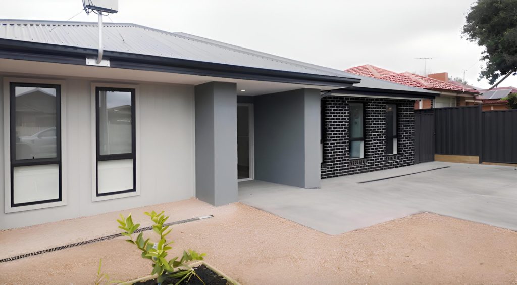 Front of the Deer Park rooming house, a single-storey home with rendered and dark brick walls