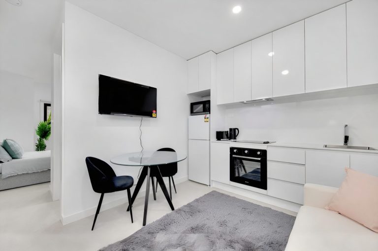 Kitchenette and dining table in a room at the Deer Park rooming house